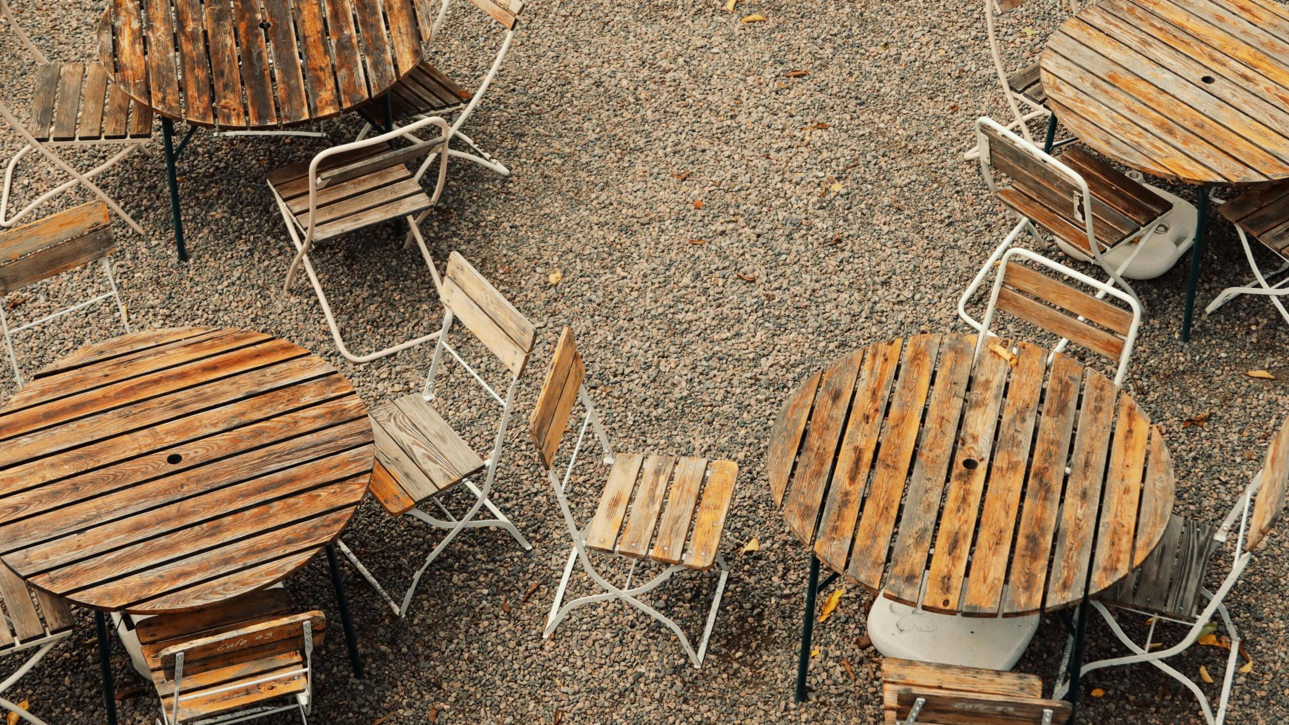 How to Design a Stunning Gravel Patio: Ideas, Costs & DIY Tips Gravel patio with pea gravel, natural stone stepping stones, and flowering plants for a naturalistic backyard design.