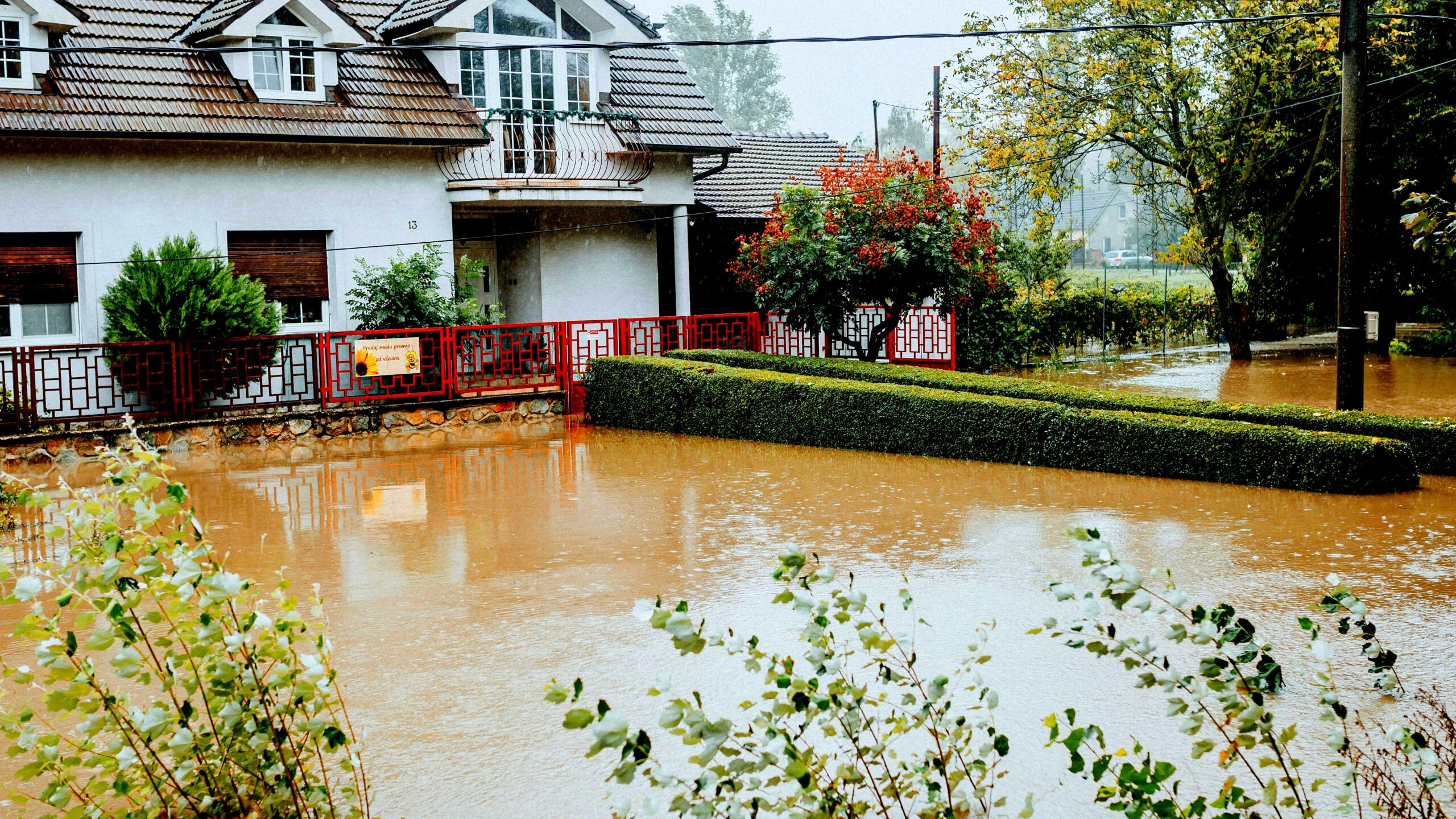 Flooded Kitchen? Compare the Top Causes of Water Damage A flooded kitchen with water pooling near appliances and cabinets, illustrating common causes of water damage