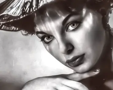 Joan Collins Channels Cowgirl in Cropped Tasselled Jacket