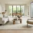 The Rug Sizing ‘Floating Island’ Trap: Why Small Rugs Shrink Spaces (and the Front-Leg Grounding Geometry)